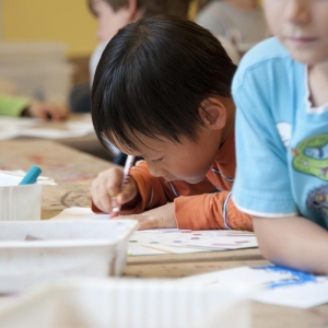 Young boy drawing at pre-school